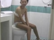 Oriental teen gives bj in the toilet